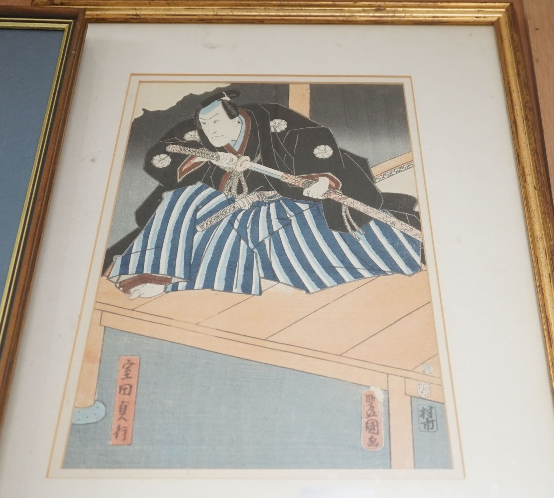 Kunisada, woodblock print, Samurai on a jetty, 33 x 23cm and another print of a Samurai, 36 x 23cm